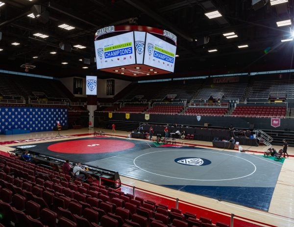 Setting up for the 2020 Pac-12 Championships at Maples Pavilion. Less than a week later, the remainder of the wrestling season was cancelled due to COVID-19. Now, the team may never return. (Photo: JOHN P. LOZANO/isiphotos.com)