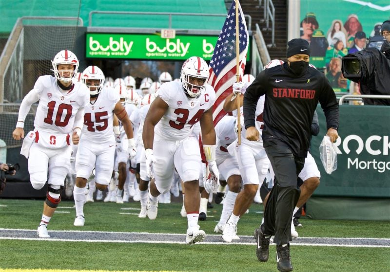 David Shaw leads Stanford football players out of the tunnel