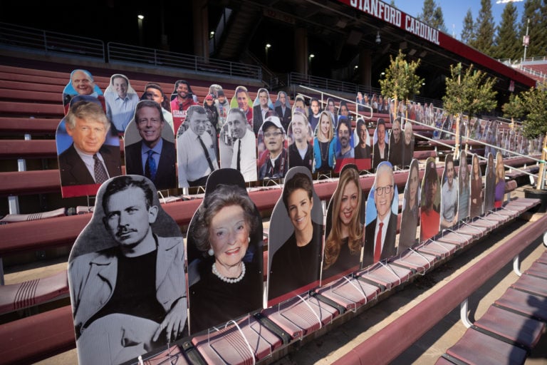 Image of stadium seats with cut outs of public figures.