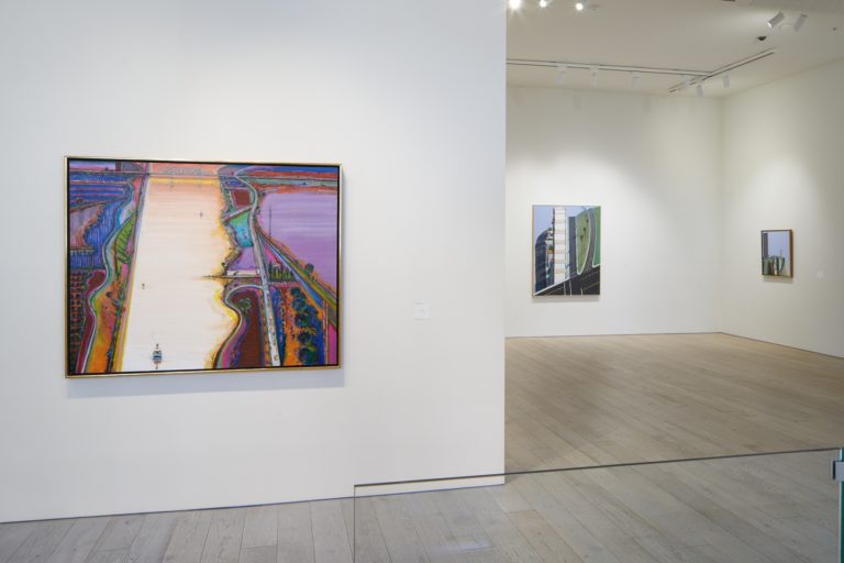 Pictured: A vibrant, landscape painting by Wayne Thiebaud installed in the Berggruen Gallery in San Francisco.