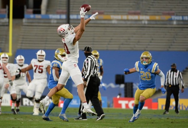 Clutch catches by junior wide receiver Brycen Tremayne (81 above) in the first quarter set the tempo for the Cardinal. (Photo courtesy of UCLA Athletics)