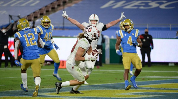 Wide receiver Simi Fehoko (13 above) had a breakout, record-setting performance for the Cardinal to close out the season. As a junior, he is draft eligible but is yet to announce his plans. (Photo courtesy of UCLA Athletics)