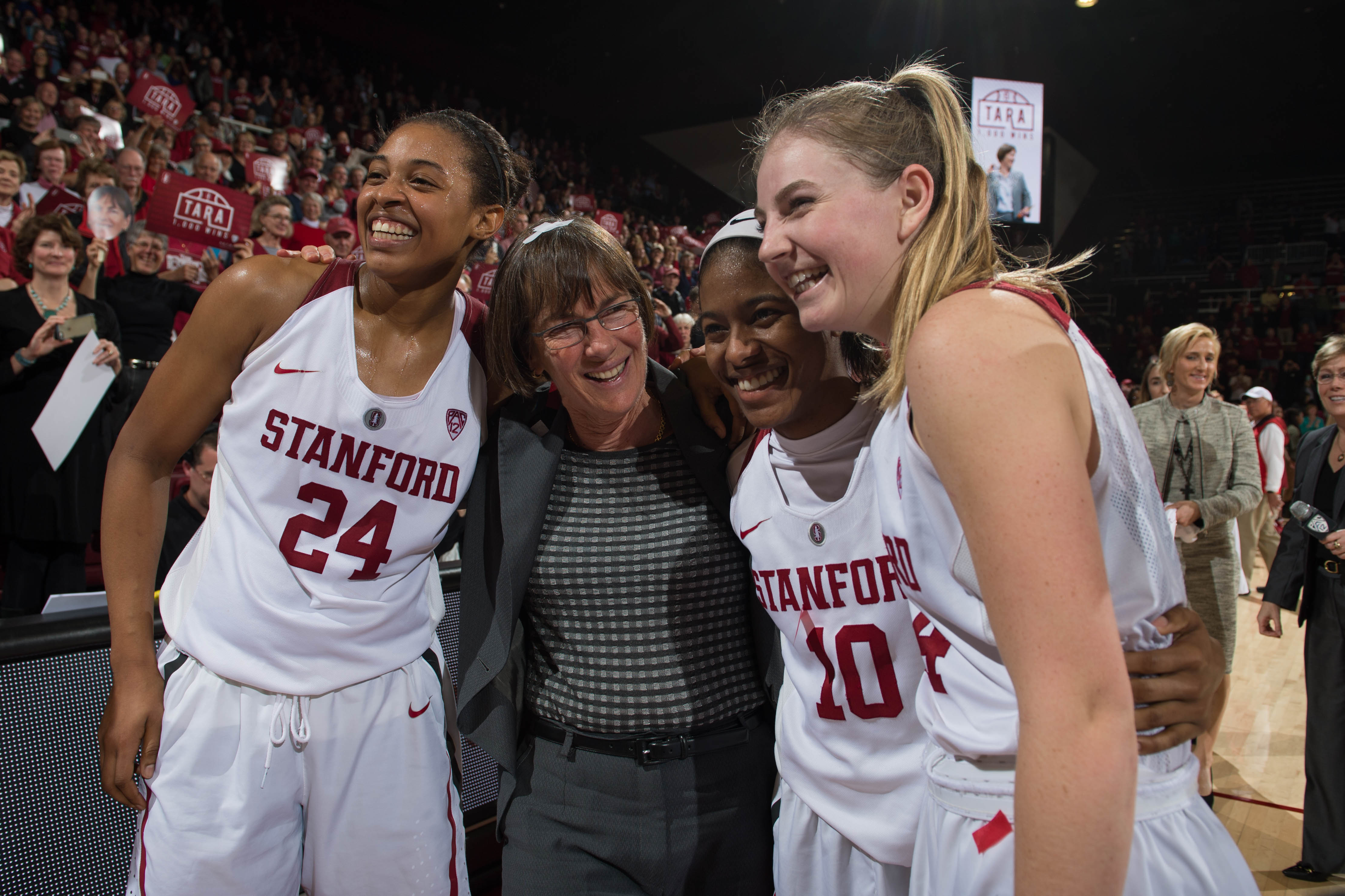 VanDerveer poses for a photo with players Erica McCall, Karlie Samuelson and Briana Roberson after Stanford defeated the visiting USC Trojans for Vanderveer's 1000th career victory.