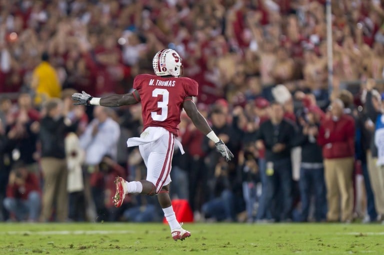 Michael Thomas '12 (above) celebrates a fumble recovery in 2011. (Photo: JIM SHORIN/isiphotos.com)