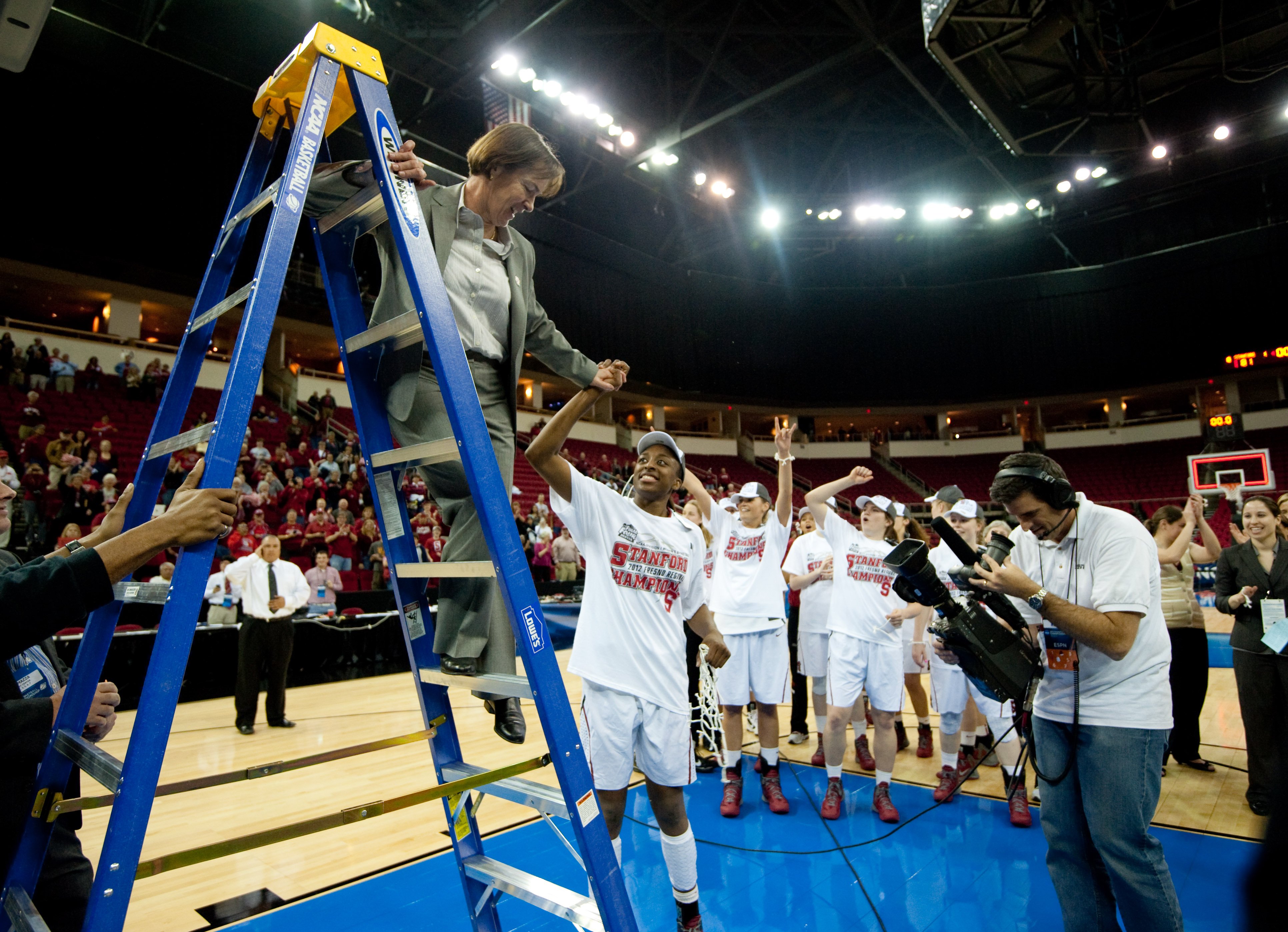 VanDerveer is helped down the ladder after giving senior Nneka Ogwumike the net after a 81-69 win over Duke at the Save Mart Center in Fresno for the West Regionals Championship of the 2012 NCAA Championships.