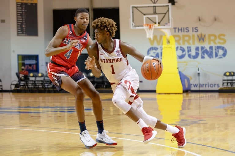 Senior guard Daejon Davis (above, 1) became the 49th player in Stanford history to reach the 1,000 career point mark on Thursday. He finished with 19 points, five rebounds, three steals and two assists in the team's 79-65 loss to Utah. (Photo: BOB DREBIN/isiphotos.com)