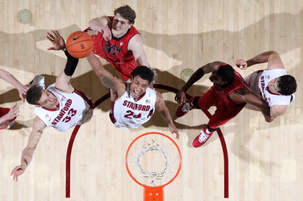 Stanford men's basketball's Josh Huestis '14 (24 above) dunks during Stanford's 61-60 victory over Utah at Maples Pavilion in March 2014. (Photo: BOB DREBIN/ISI Photos)