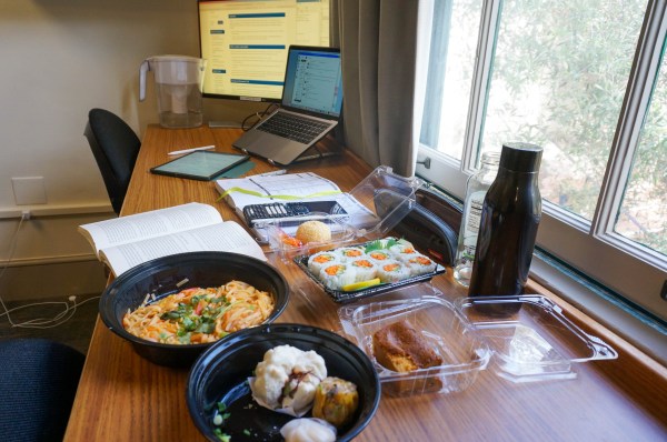 Crystal Chen studies from inside her dorm with Lunar New Year dishes. (Photo: CRYSTAL CHEN / The Stanford Daily)