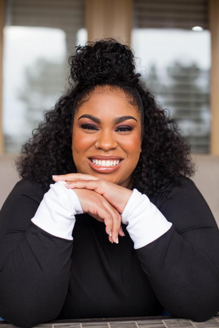 headshot of Angie Thomas, author of "The Hate U Give"