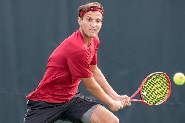 Senior Axel Geller (above) secured the clinching point for Stanford's men's tennis against Saint Mary's on Friday. With a 2-0 record, the Cardinal now gears up for four matches in seven days, with UCLA being the first challenge on Monday. (Photo: LYNDSAY RADNEDGE/isiphotos.com)