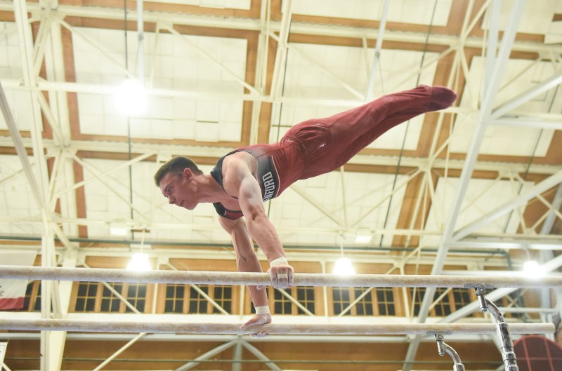 Junior Brody Malone (above) came in clutch on the parallel bars and horizontal bar to avoid a second loss for the Cardinal this season. (Photo: CODY GLENN/isiphotos.com)