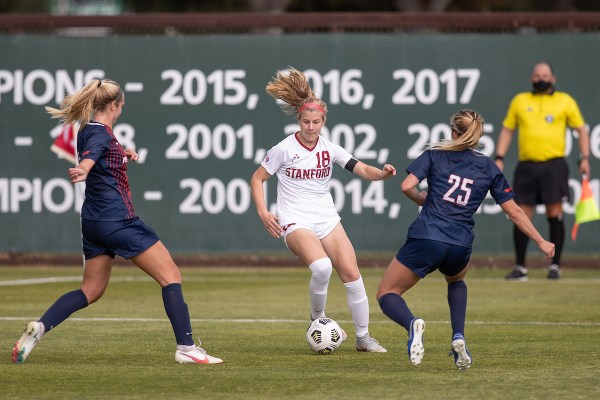 Freshman midfielder Catherine Paulson (above, middle) works her way between two Pepperdine players in the Cardinal's earlier season matchup. Paulson was a key player in Friday's win over Utah. (Photo: MACIEK GUDRYMOWICZ/isiphotos.com)
