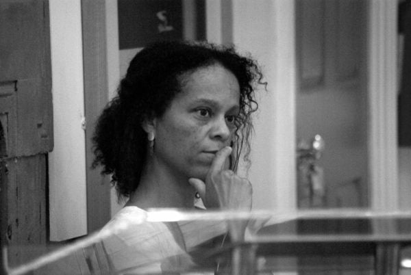 a black and white image of Bernardine Evaristo, author of "Girl, Woman, Other," looking pensive