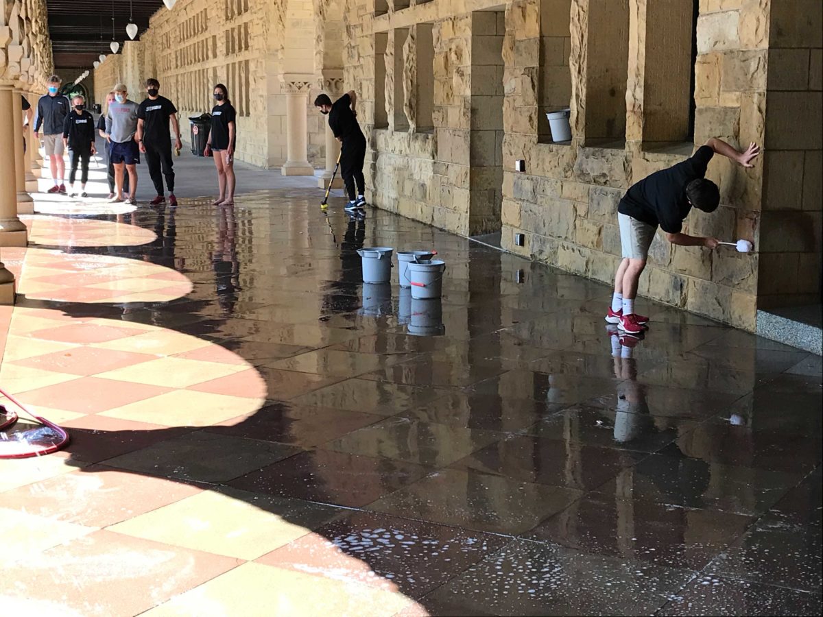 Stanford athletes spray slogans on Building 10 after 36 Sports Strong Rally