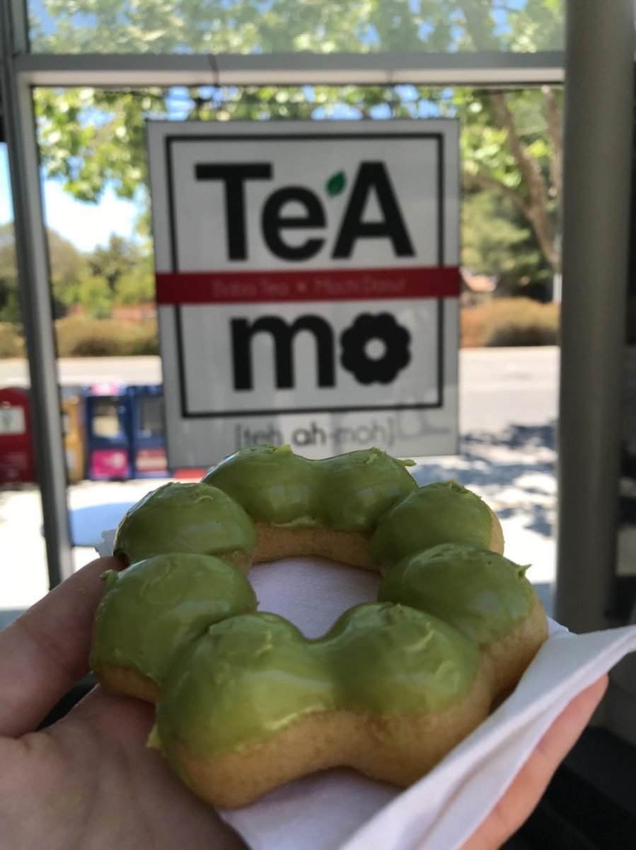 The matcha mochi donut is a Japanese pastry dipped in matcha paste.