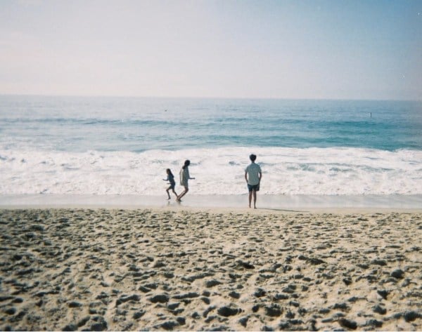 Tara's mother and siblings on a California beach