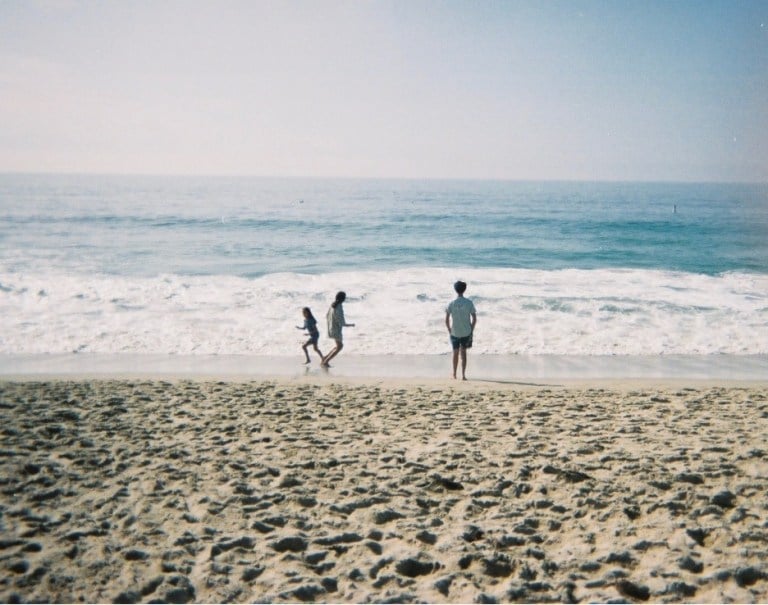 Tara's mother and siblings on a California beach