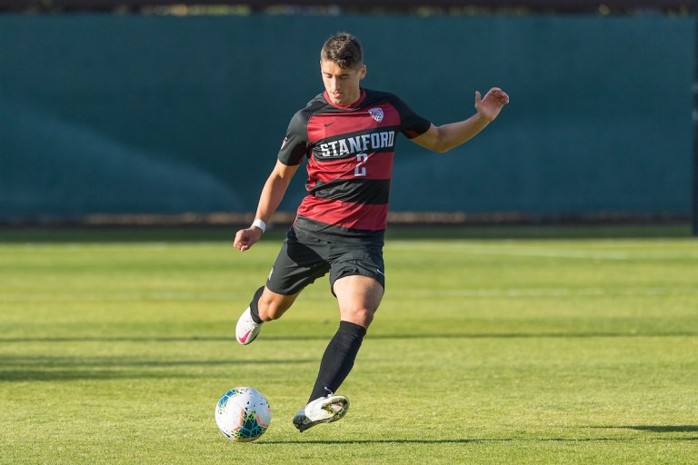 Andrew Aprahamian kicking the soccer ball