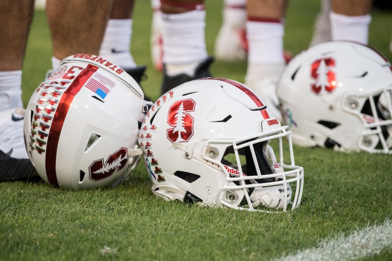 Stanford football helmets lie on the sideline during a game against UCLA.