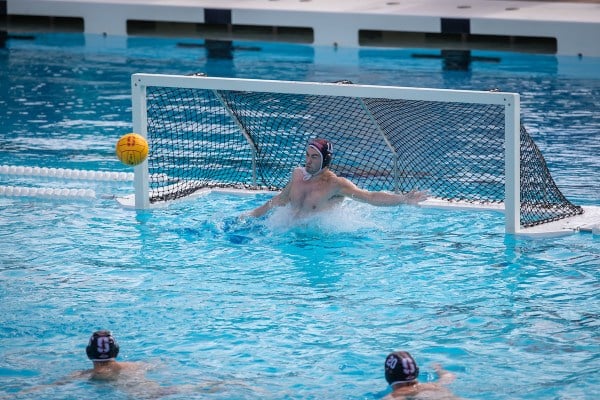 The ball shot at the water polo goal
