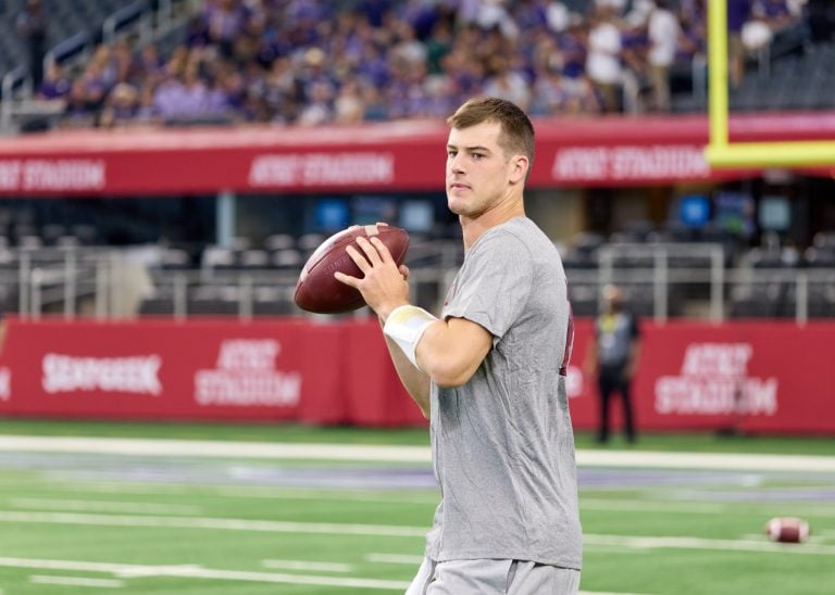 Stanford quarterback Tanner McKee looks to throw the football during pregame warmups.