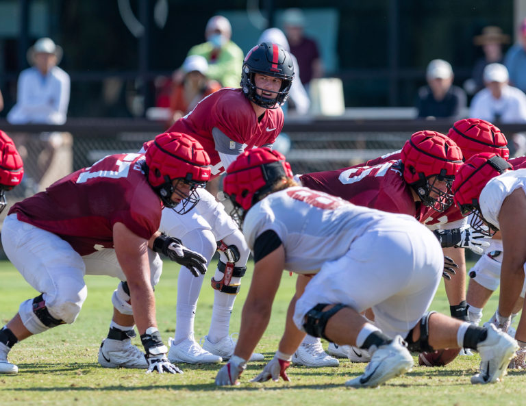 An action photo of Stanford football and sophomore quarterback Tanner McKee during practice.