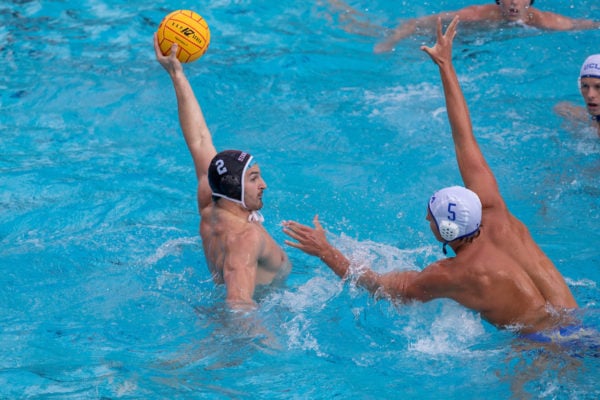 Action shot of Stanford men's water polo driver Tyler Abramson