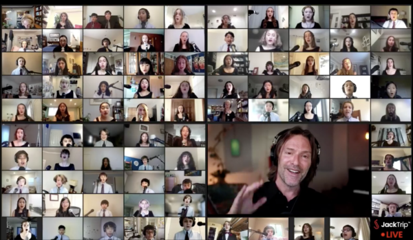 Screenshot of a JackTrip Live performance on Zoom with many people singing together and Eric Whitacre conducting.