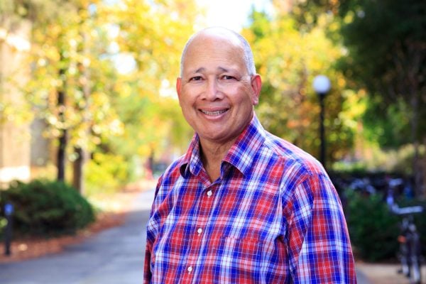 George Brown, Executive Director of the Stanford Center for Racial Justice, stands for a photo near Stanford Law School. (Photo: NIKOLAS LIEPINS/The Stanford Daily)