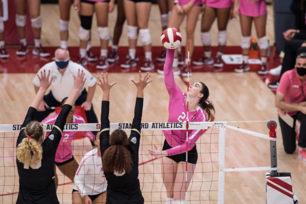 Redshirt sophomore outside hitter Caitie Baird rises for a spike against Colorado.