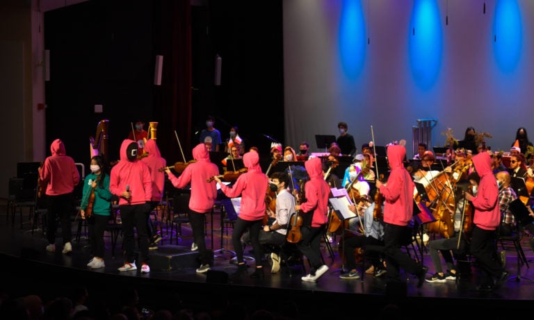 Students on stage in costume for the Halloween concert.