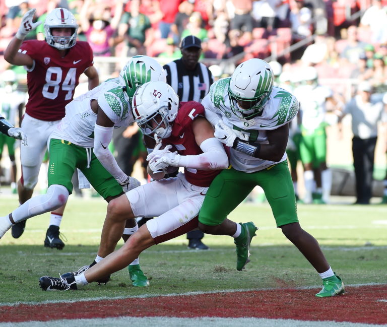 John Humphreys charges into the endzone against Oregon defense.