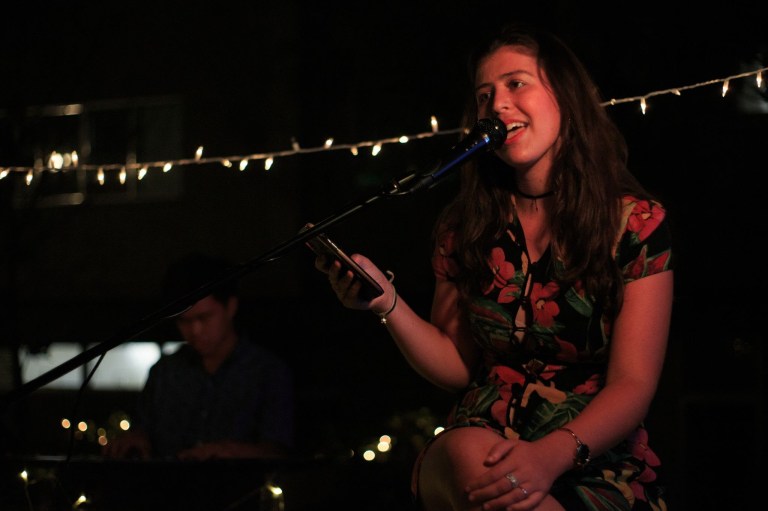 Julia Segal singing outdoors