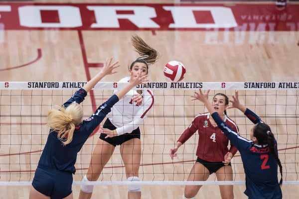 Redshirt sophomore middle blocker McKenna Vicini sneaks a spike through the defense.