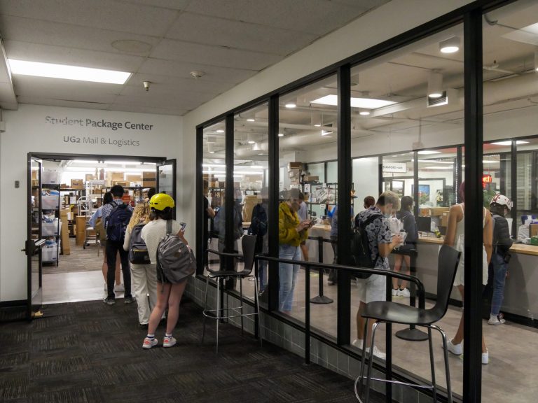 Students wait in line for packages at the Tressider Package Center