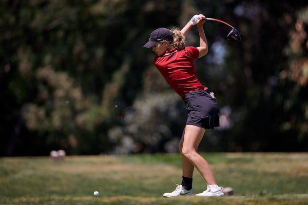 Sophomore Rachel Heck reaches the top of her backswing before a tee shot.