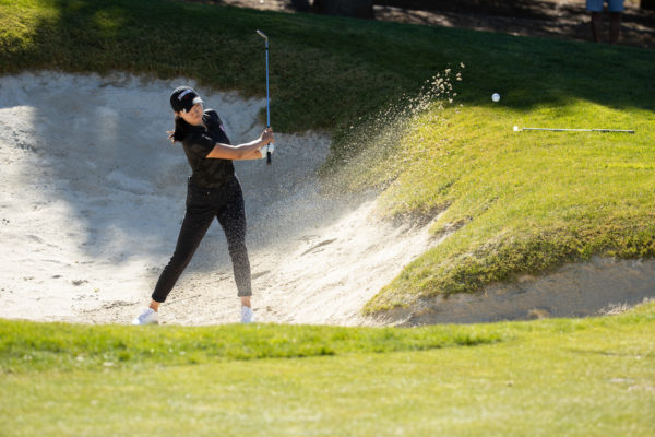 Freshman Rose Zhang blasts out of a bunker on the Stanford Golf Course.