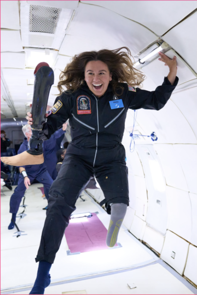 Mary Cooper in a spacesuit floating midair