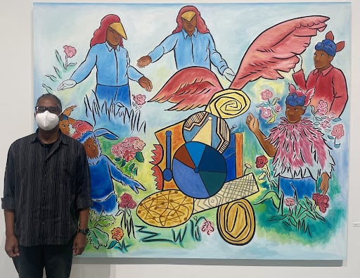 Holt Visiting Artist John Bankston poses next to an untitled work.