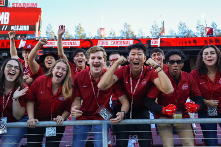 The Axe Committee, the guarder of the Stanford Axe, cheer on the Cardinal from the bleachers.