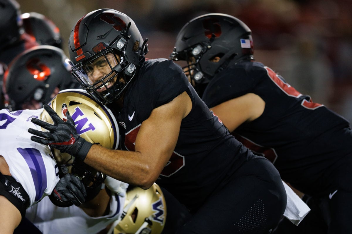 Football players for Stanford and Washington clash. 
