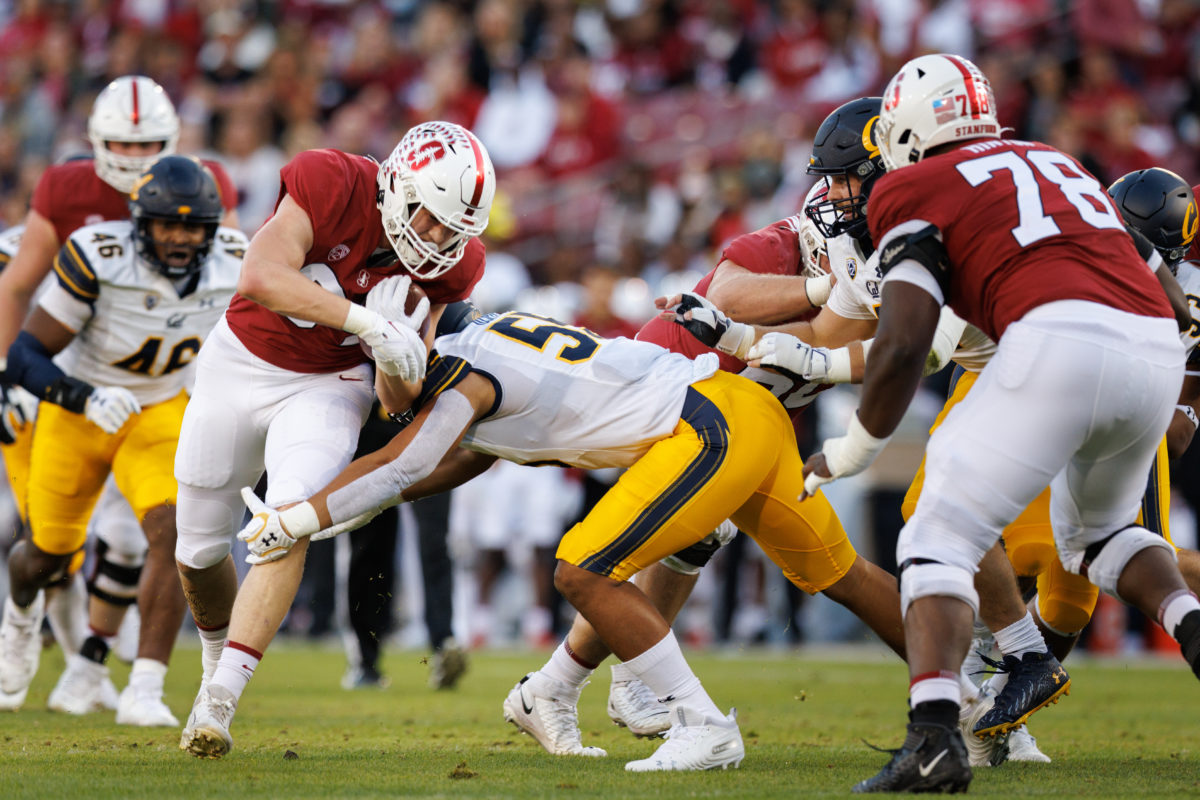 Stanford and Cal football players clashing on the field