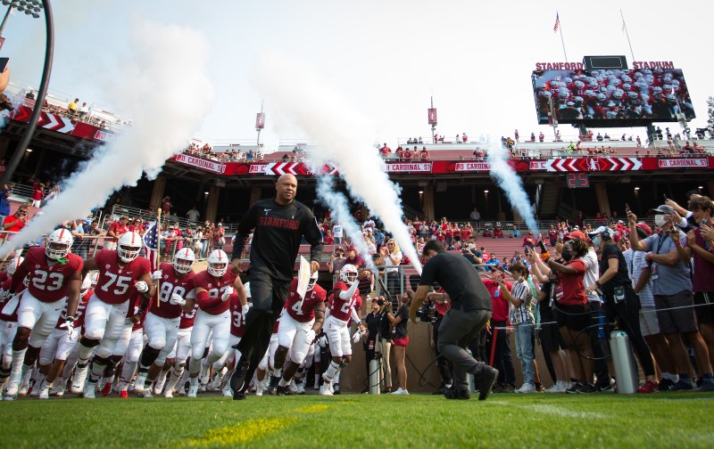 David Shaw leads Stanford players out of the tunnel at a home football game