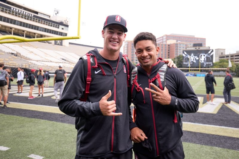 Tanner McKee and Isaiah Sanders pose next to one another on the sidelines.