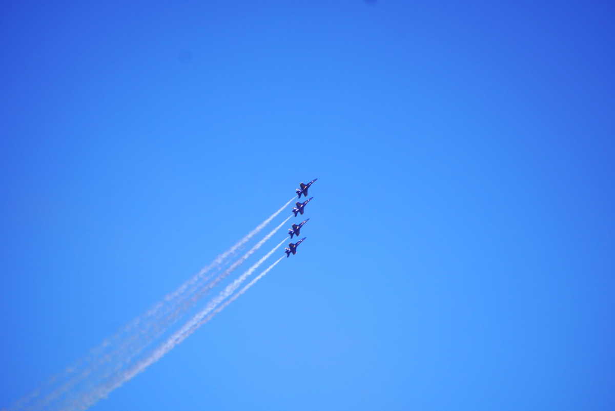 Four jets fly together in a straight formation.