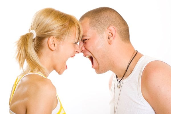 A woman and man yelling at each other in close quarters