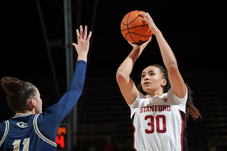 Junior forward Haley Jones shoots over a defender.