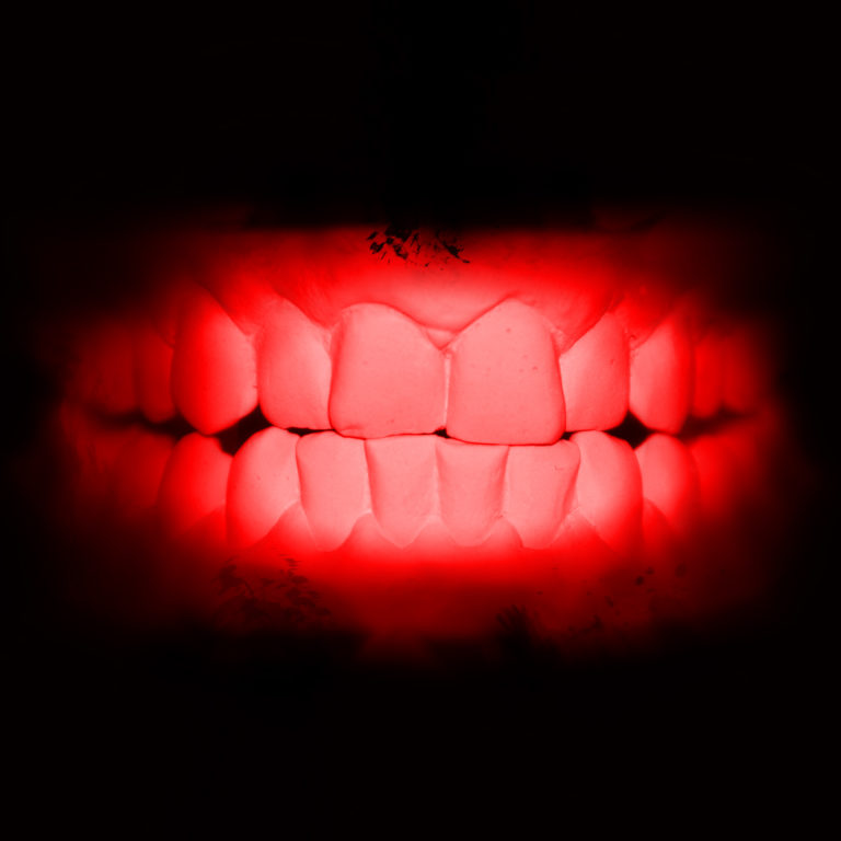clenched mouth showing teeth