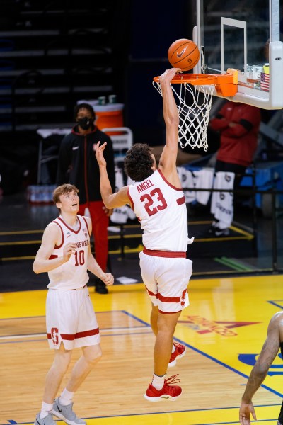 Sophomore forward Brandon Angel jumps up to dunk the ball.