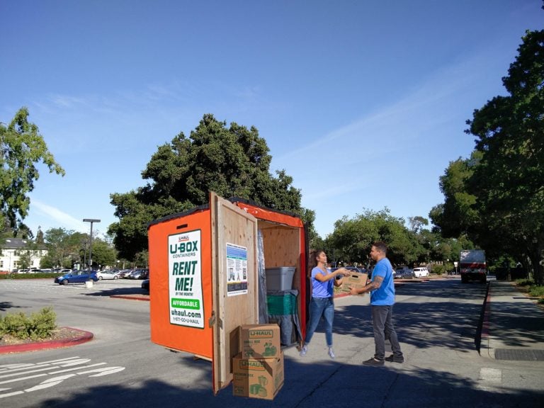 Student moving into a storage container in the Tresidder Parking Lot